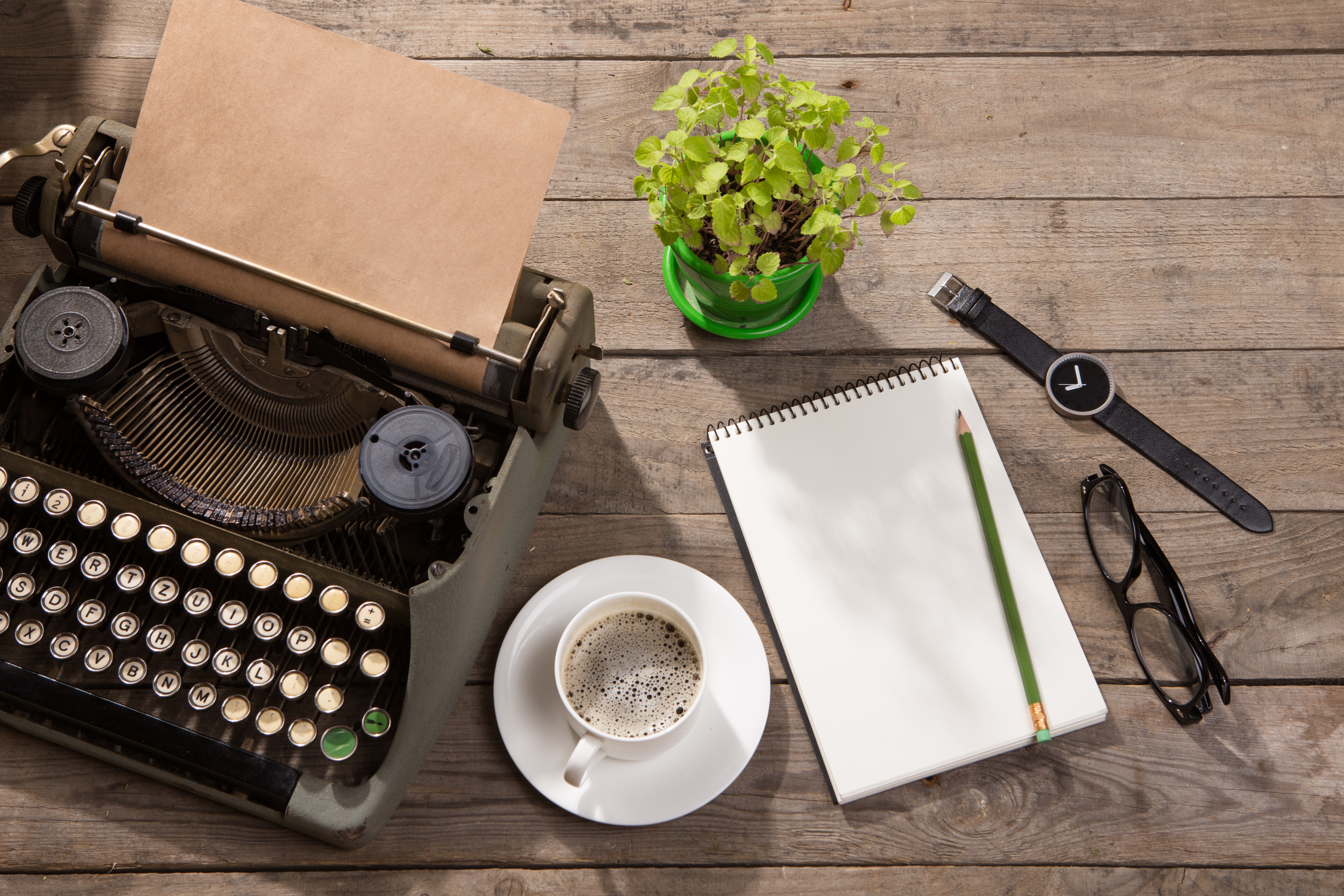 Vintage typewriter on the old wooden desk